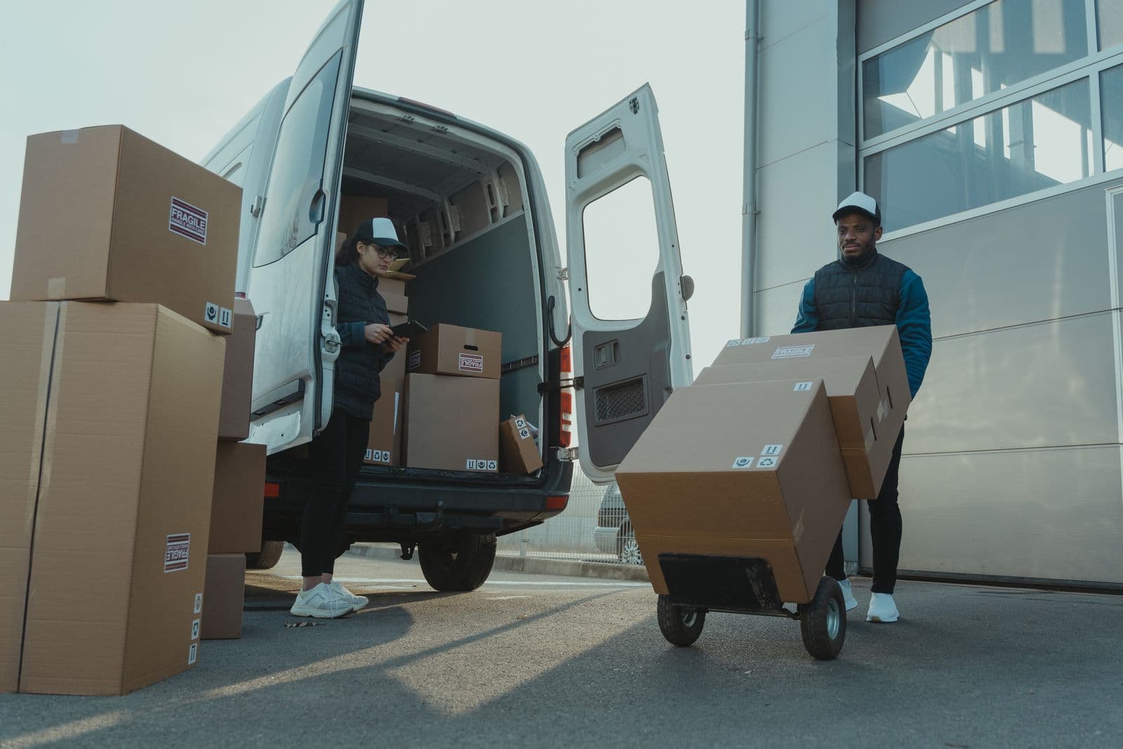 Cargo van being loaded with packages for goods transport